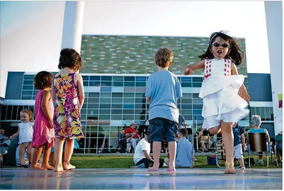  ?? AMERICAN-STATESMAN 2010 ?? Isabella Matamorosm, 3, dances along with the Austin Symphony Chamber Winds during the Hartman Concerts in the Park.