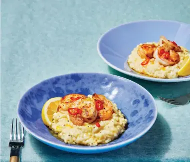  ?? ?? Megan McKenna's parmesan risotto with garlic prawns. Images: PA Photo/Louise Hagger