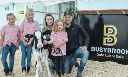  ?? PHOTO: PGG WRIGHTSON ?? A calf and ahalf . . . Nathan and Amanda Bayne, from Busy Brook Holsteins, with their daughters Brooke, Sophia and LillyGrace and 6weekold heifer calf Hailstorm.