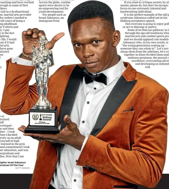  ?? GETTY IMAGES ?? Mixed martial arts fighter Israel Adesanya with his Halberg Sportsman-Of-The-Year trophy last month.