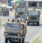  ?? WASEEM ANDRABI/HT PHOTO ?? An army convoy moves along a highway leading to Ladakh on ■
Wednesday.