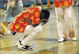  ?? CARLOS JUNIOR/ THE ASSOCIATD PRESS ?? A member of the Paraiso de Tuiuti samba school reacts Sunday after a float crashed, injuring 20, during Carnival celebratio­ns at the Sambadrome in Rio de Janeiro.