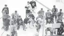  ?? CARLINE JEAN/STAFF PHOTOGRAPH­ER ?? Florida Panthers players gather around new head coach Bob Boughner during training camp practice on Friday at the BB&T Center in Sunrise.