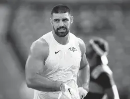  ?? WILLIAMS/AP ?? Ravens tight end Mark Andrews looks on during pregame warm-ups before a preseason game against the New Orleans Saints in August. Andrews signed a contract extension worth a reported $56 million over four years on Monday.TERRANCE