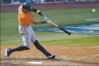  ?? AP photo ?? Houston’s Carlos Correa hits a solo home run during the seventh inning of the Astros’ Game 1 win over the Oakland Athletics on Monday.