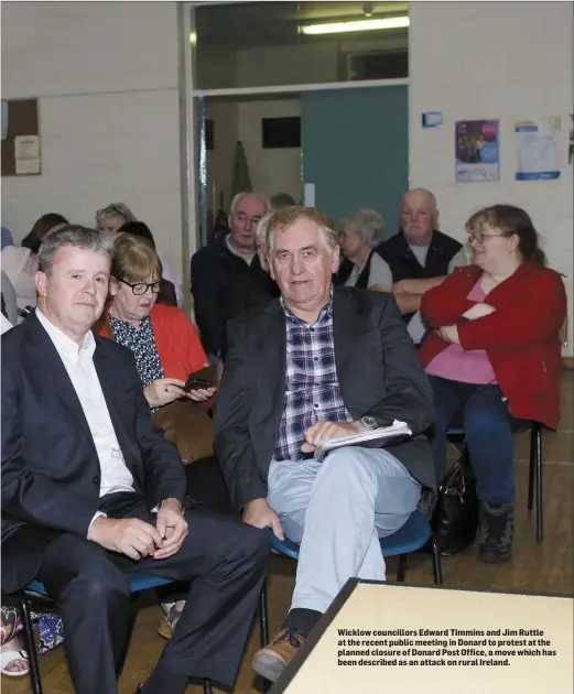  ??  ?? Wicklow councillor­s Edward Timmins and Jim Ruttle at the recent public meeting in Donard to protest at the planned closure of Donard Post Office, a move which has been described as an attack on rural Ireland.