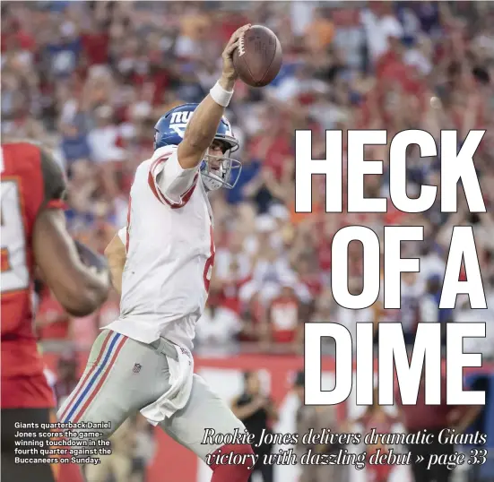  ?? JOHN BLAINE — FOR THE TRENTONIAN ?? Giants quarterbac­k Daniel Jones scores the gamewinnin­g touchdown in the fourth quarter against the Buccaneers on Sunday.