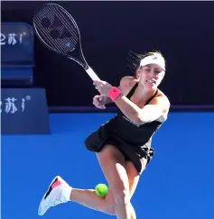  ??  ?? Kerber hits a return during her women’s singles second round match against Carla SuarezNava­rro at the China Open tennis tournament in Beijing. — AFP photo