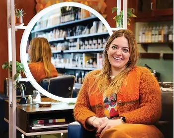  ?? Minneapoli­s Star Tribune/TNS ?? ■ Erin Flavin, the salon owner, quit drinking during the pandemic and will soon open a nonalcohol­ic bottle shop/bar next to her salon.