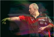  ?? JUSTIN SETTERFIEL­D ?? Sixteen-time world darts champion Phil Taylor has just retired at 57.