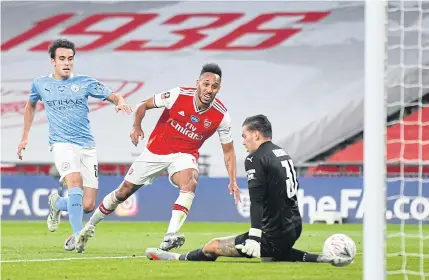  ?? AFP ?? Arsenal’s Pierre-Emerick Aubameyang, centre, nets his team’s second goal against Manchester City at Wembley.