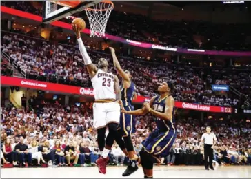  ?? GREGORY SHAMUS/GETTY IMAGES/AFP ?? LeBron James #23 of the Cleveland Cavaliers goes to the basket against the Indiana Pacers in the second half in Game One of the Eastern Conference Quarterfin­als during the NBA Playoffs at Quicken Loans Arena on Saturday in Cleveland, Ohio.