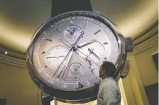  ?? FABRICE COFFRINI/AFP/GETTY IMAGES ?? Richemont is the only major luxury goods firm to join the pre-owned market with its purchase of online store Watchfinde­r. It views the market as the best place to assess watch value.