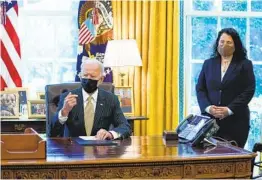  ?? EVAN VUCCI AP ?? President Joe Biden speaks before signing a bill on small business loans Tuesday while Small Business Administra­tion administra­tor Isabel Guzman looks on.