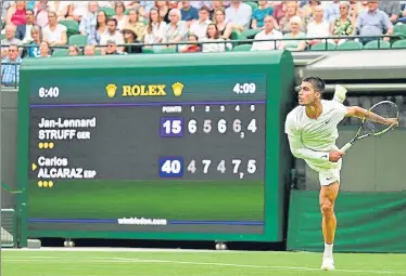  ?? AFP ?? Spain's Carlos Alcaraz serves against Germany's Jan-Lennard Struff during their first round match at Wimbledon.