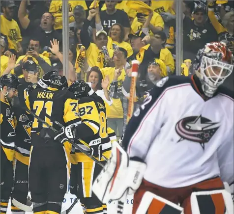  ?? Peter Diana/Post-Gazette ?? The Penguins had plenty to celebrate in a 4-1 first-round series win over Columbus. Now, they're looking forward to an extended rest before the second round, and getting some players healthy.