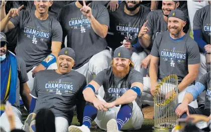  ?? Photos /AP ?? An unmasked Justin Turner (red beard) celebrated with the Dodgers despite testing positive for Covid-19.