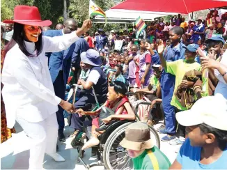  ?? Picture: Believe Nyakudjara ?? The Patron of Danhiko Project, First Lady Amai Grace Mugabe, is welcomed by participan­ts on her arrival at Danhiko Rehabilita­tion Centre for the official opening of the annual paralympic games in Harare yesterday. (See story on Page 3)—