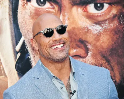  ?? THE ASSOCIATED PRESS ?? Dwayne Johnson’s father, Rocky, is an African Nova Scotian pro wrestler, whose life story may be coming to the big screen.