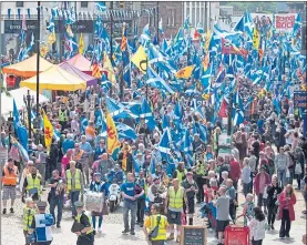  ??  ?? Thousands of pro-independen­ce supporters march through Dumfries