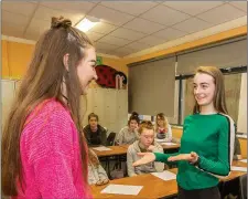  ??  ?? St Mary’s Secondary School Macroom TY Students, Savannah Hickey & Lauren Healy, learning the sign language skills, guided by instructor Richie O’Mahony, as part of a series of workshops