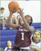  ?? Scott Herpst ?? JaMiah Lewis drives to the hoop during Chattanoog­a Valley’s game at Rossville last week. Lewis had a double-double against the Lady Bulldogs on Tuesday and followed up two nights later with a triple-double against Dade.