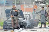  ?? AP ?? Security personnel inspect a damaged car in Kabul, Afghanista­n on Tuesday.