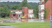  ?? / Doug Walker ?? A large, flat grassy area is flanked by nice concrete pads at the old Lindale Mill. Owners Joe and Dani Silva are hoping to start hosting outdoor concerts as well as outdoor weddings at “The Mill Ruins.”