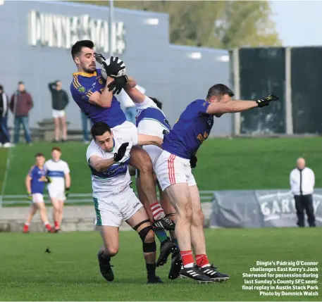  ??  ?? Dingle’s Pádraig O’Connor challenges East Kerry’s Jack Sherwood for possession during last Sunday’s County SFC semifinal replay in Austin Stack Park Photo by Domnick Walsh