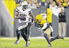  ?? MATT LUDTKE / AP ?? Chargers tight end Antonio Gates (left) suffered a sprained MCL last week at Green Bay and considers himself a game-time decision to face the Raiders on Sunday.