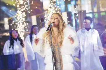  ?? Brent N. Clarke Invision ?? MARIAH CAREY performing in Sunday’s annual live-from-Times-Square “New Year’s Rockin’ Eve” show.