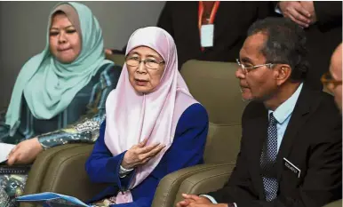  ??  ?? Concerned ministers: (From left) Rina, Dr Wan Azizah and Dr Maszlee speaking to the media during a press conference after chairing the national Children’s Well-being Roadmap meeting in Putrajaya. — Bernama