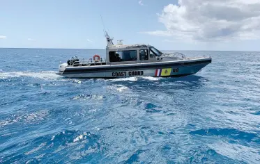  ??  ?? Off the coast of St. Maarten, a patrol boat shadowed Avocation, making sure her skipper did not come ashore.