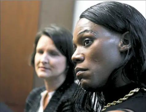  ?? Nate Guidry/Post-Gazette ?? Jules Williams, right, a 37-year-old transgende­r woman, Sara Rose of the American Civil Liberties Union of Pennsylvan­ia discuss the lawsuit they filed Monday on her behalf against Allegheny County.