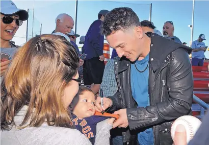  ?? JIM THOMPSON/JOURNAL ?? Houston Astros third baseman Alex Bregman signs the hoodie of Caden Williams for his mother Elizabeth Williams during Wednesday’s grand opening of the Albuquerqu­e Regional Sports Complex.