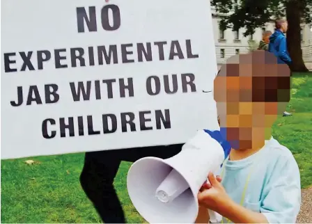  ?? ?? Propaganda: Youngsters with loud speakers spout anti-vax nonsense on a so-called freedom march