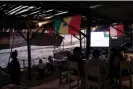  ?? ?? People watching a World Cup match at a restaurant on the Dakar coastline.