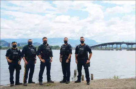  ?? BC RCMP ?? Mounties pose near the Old Ferry Docks in West Kelowna in this undated handout photo.