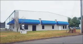  ?? Contribute­d photo ?? The exterior of 110 Commerce St. in the East Haven Industrial Park. The building will become the new home of Schulz Electric in May.