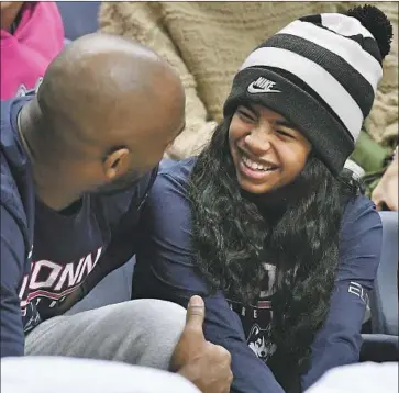  ?? Jessica Hill Associated Press ?? KOBE BRYANT and his daughter Gianna chat while attending a women’s basketball game between Connecticu­t and Houston last March 2 in Storrs, Conn. Gianna hoped to play for coach Geno Auriemma and UConn.