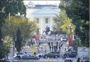  ?? J. SCOTT APPLEWHITE — THE ASSOCIATED PRESS ?? The White House is seen in Washington, early Tuesday, the morning after President Donald Trump returned fromthe hospital where he was treated for COVID-19.