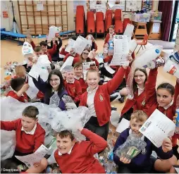  ?? Angela Christofil­ou ?? Schoolchil­dren at St Wulstan’s RC Primary School with their plastic waste