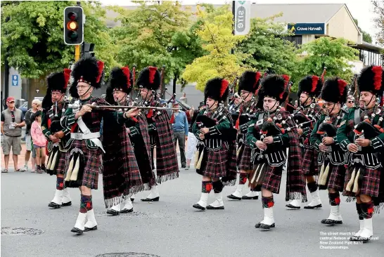  ??  ?? The street march through central Nelson at the 2015 Royal New Zealand Pipe Band Championsh­ips.