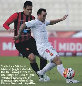  ??  ?? Valletta’s Michael Mifsud (right) shields the ball away from the challenge of Luis Miguel Verdara Rodrigues of Hamrun Spartans (left). Photo: Domenic Aquilina