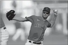  ?? JOHN BAZEMORE/AP PHOTO ?? Boston Red Sox starting pitcher Chris Sale throws during spring training on Feb. 19 in Sarasota, Fla.