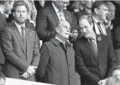  ?? Alastair Grant / Associated Press ?? In 2015, Prince Harry, left, and his brother Prince William, right, stand with their grandfathe­r, the Duke of Edinburgh, at the Rugby World Cup final.