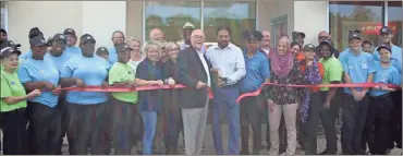  ?? / Kevin Myrick ?? Local officials joined the staff and ownership at the new Captain D’s in Rockmart for a ribbon cutting ceremony on Saturday, June 30. The restaurant officially opened for customers on Monday.