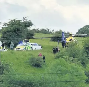  ??  ?? Emergency services at the scene of the incident at Smithy Bridge