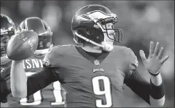  ?? CURTIS COMPTON/TRIBUNE NEWS SERVICE ?? Philadelph­ia Eagles quarterbac­k Nick Foles completes a pass against the Atlanta Falcons in an NFC Divisional Game on January 13 in Philadelph­ia.