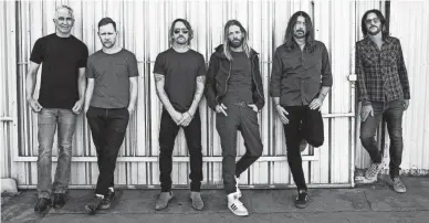  ?? DANNY CLINCH ?? Dave Grohl, second from right, and Foo Fighters celebrate their 25th year with “Medicine at Midnight.”